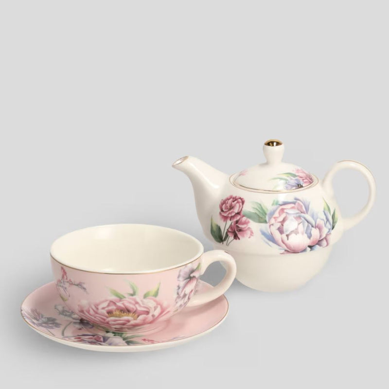 Bielo ružový porcelánový čajník so šálkou s podšálkou s kvetovým motívom.